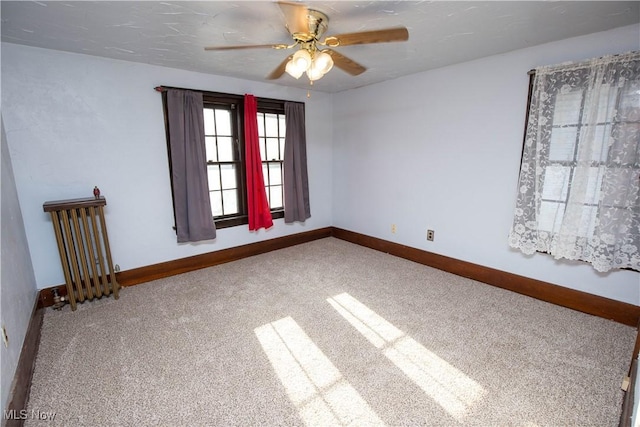 1299 Herberich Ave, Akron, OH 44301 - empty room featuring carpet flooring and a ceiling fan