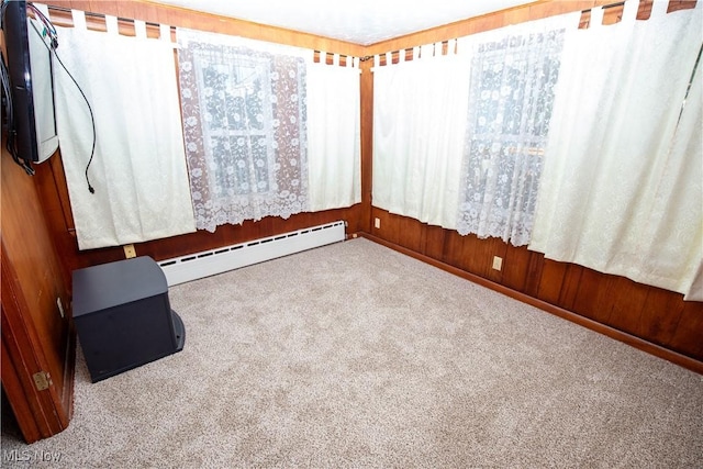 1299 Herberich Ave, Akron, OH 44301 - carpeted spare room with a baseboard heating unit and baseboards