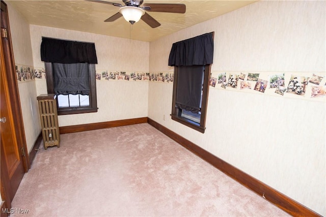 1299 Herberich Ave, Akron, OH 44301 - spare room featuring ceiling fan and carpet