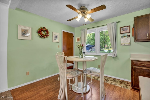 2061 Garden Ln, Hudson, OH 44236 - dining area featuring a textured ceiling, light wood-style floors, and a ceiling fan