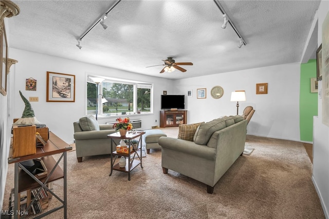 2061 Garden Ln, Hudson, OH 44236 - living area with track lighting, a textured ceiling, a ceiling fan, and carpet floors
