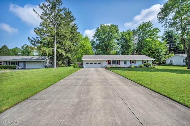 2061 Garden Ln, Hudson, OH 44236 - single story home featuring an attached garage, a front lawn, driveway, and view of scattered trees