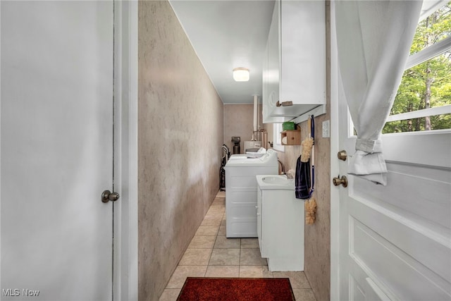 2061 Garden Ln, Hudson, OH 44236 - laundry room featuring washing machine and dryer, light tile patterned flooring, and cabinet space