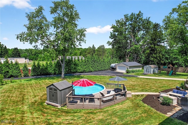 3905 Greenwich Rd, Norton, OH 44203 - view of yard with a storage shed, a deck, and a playground