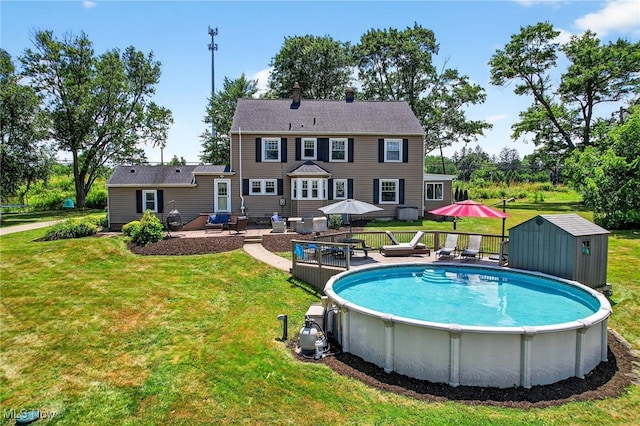 3905 Greenwich Rd, Norton, OH 44203 - swimming pool with a deck, a lawn, and a shed