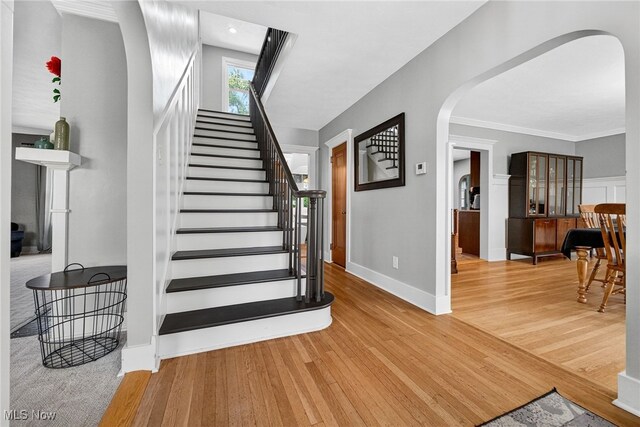 3905 Greenwich Rd, Norton, OH 44203 - staircase featuring arched walkways and wood finished floors