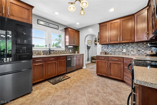 3905 Greenwich Rd, Norton, OH 44203 - kitchen with smart refrigerator, dishwasher, arched walkways, black electric range, and backsplash