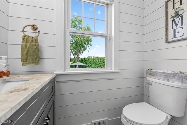 3905 Greenwich Rd, Norton, OH 44203 - bathroom featuring vanity and wooden walls