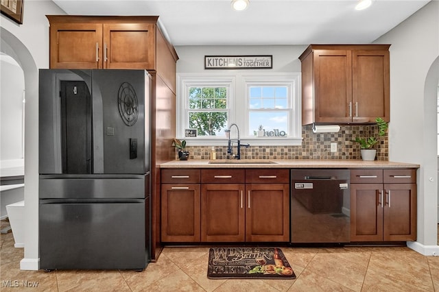 3905 Greenwich Rd, Norton, OH 44203 - kitchen featuring dishwasher, freestanding refrigerator, arched walkways, decorative backsplash, and recessed lighting