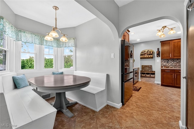 3905 Greenwich Rd, Norton, OH 44203 - dining area with breakfast area, arched walkways, recessed lighting, and light tile patterned floors