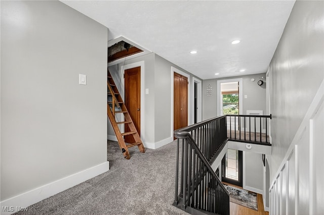 3905 Greenwich Rd, Norton, OH 44203 - hall with an upstairs landing, carpet floors, and recessed lighting