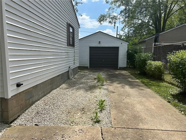 1345 Autumn Dr NW, Warren, OH 44485 - view of side of property with concrete driveway, a garage, and an outdoor structure