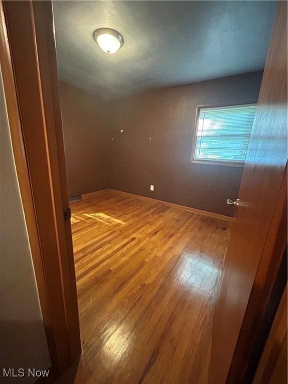 1345 Autumn Dr NW, Warren, OH 44485 - unfurnished room featuring wood finished floors