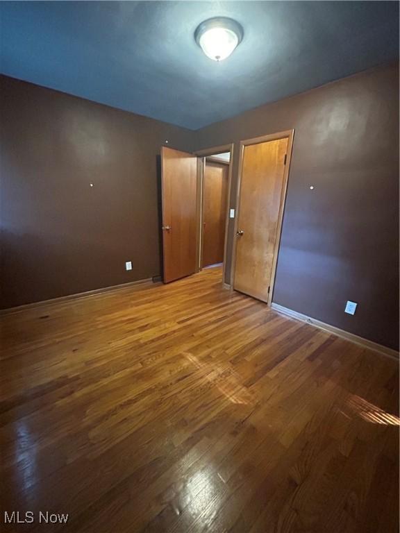 1345 Autumn Dr NW, Warren, OH 44485 - unfurnished bedroom with wood finished floors