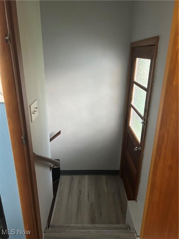 1345 Autumn Dr NW, Warren, OH 44485 - stairs featuring wood finished floors