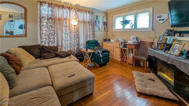 612 W Osborne St, Sandusky, OH 44870 - living area with ornamental molding, wood-type flooring, and arched walkways