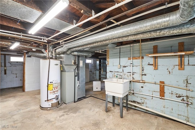 1021 Perry Ave, Barberton, OH 44203 - below grade area featuring gas water heater and heating unit
