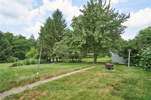 1021 Perry Ave, Barberton, OH 44203 - view of green lawn with a fire pit