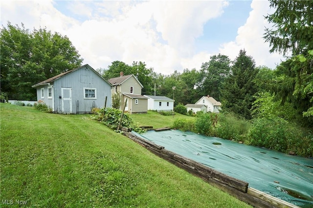 1021 Perry Ave, Barberton, OH 44203 - view of grassy yard featuring an outdoor structure