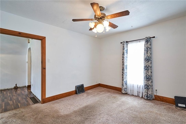 1021 Perry Ave, Barberton, OH 44203 - carpeted spare room with arched walkways and ceiling fan