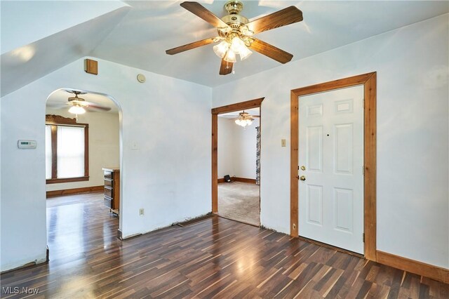 1021 Perry Ave, Barberton, OH 44203 - unfurnished room with a ceiling fan, wood finished floors, arched walkways, and vaulted ceiling