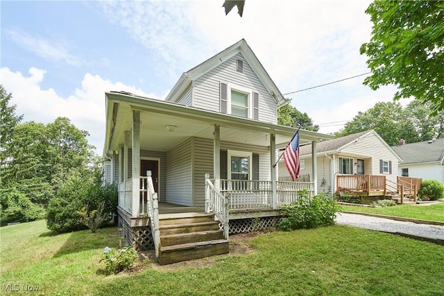 1021 Perry Ave, Barberton, OH 44203 - view of front of home featuring a porch and a front lawn