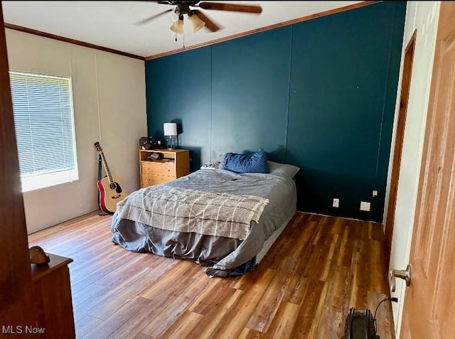 1711 Hardins Run Rd, New Cumberland, WV 26047 - bedroom with ornamental molding, wood finished floors, and ceiling fan