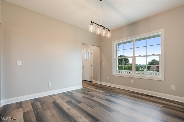 8452 Beatty St NW, Massillon, OH 44646 - spare room featuring dark wood-type flooring