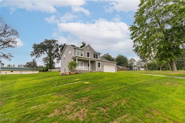 8452 Beatty St NW, Massillon, OH 44646 - view of front of property with a front lawn, an attached garage, and a porch