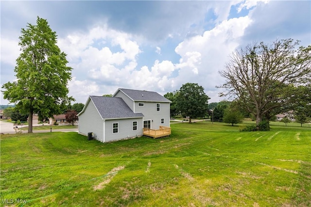 8452 Beatty St NW, Massillon, OH 44646 - rear view of house with a wooden deck and a lawn
