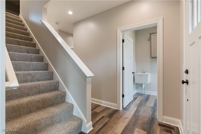 8452 Beatty St NW, Massillon, OH 44646 - stairs featuring wood finished floors and recessed lighting