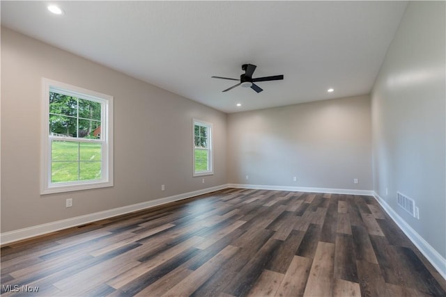 8452 Beatty St NW, Massillon, OH 44646 - empty room with healthy amount of natural light, ceiling fan, dark wood-type flooring, and recessed lighting