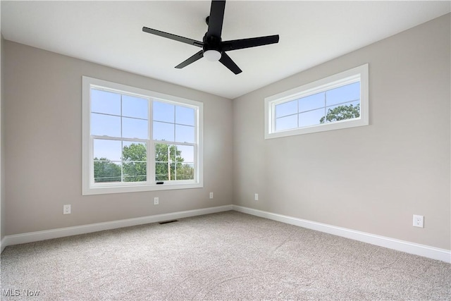 8452 Beatty St NW, Massillon, OH 44646 - carpeted spare room featuring baseboards and a ceiling fan