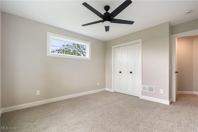 8452 Beatty St NW, Massillon, OH 44646 - unfurnished bedroom featuring carpet flooring, a closet, and ceiling fan