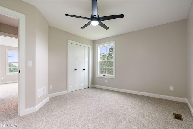 8452 Beatty St NW, Massillon, OH 44646 - unfurnished bedroom featuring carpet flooring, a closet, and ceiling fan