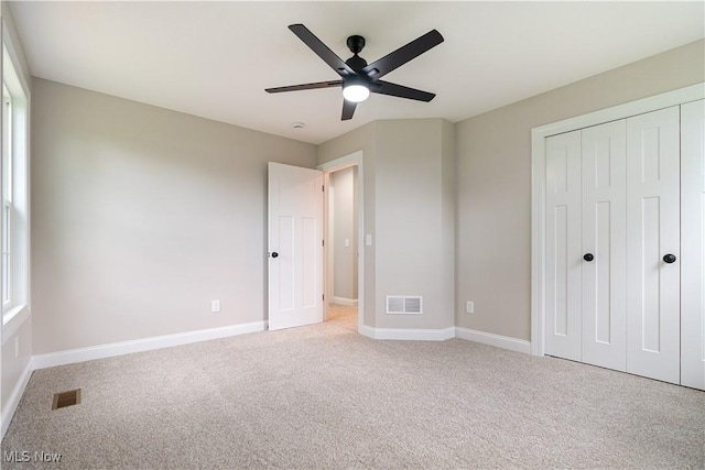 8452 Beatty St NW, Massillon, OH 44646 - unfurnished bedroom featuring carpet flooring, a closet, and ceiling fan