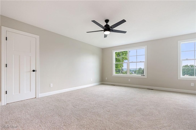 8452 Beatty St NW, Massillon, OH 44646 - carpeted empty room featuring a ceiling fan and baseboards