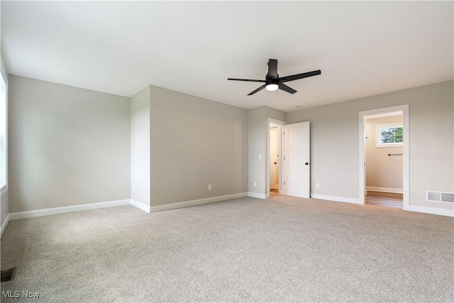 8452 Beatty St NW, Massillon, OH 44646 - unfurnished bedroom featuring light carpet and a ceiling fan