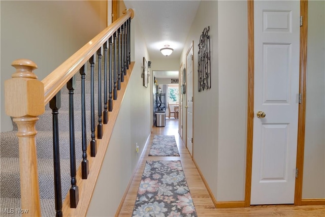 2939 Sandhill Rd, Marietta, OH 45750 - hall featuring light wood finished floors and stairs