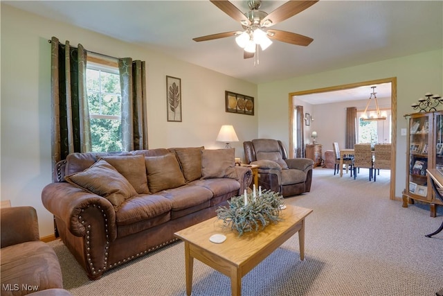 2939 Sandhill Rd, Marietta, OH 45750 - living area featuring a chandelier, light colored carpet, and ceiling fan