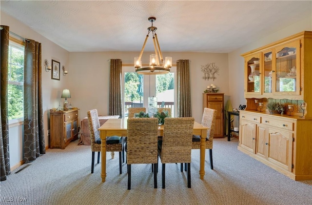 2939 Sandhill Rd, Marietta, OH 45750 - dining space featuring light carpet and a chandelier