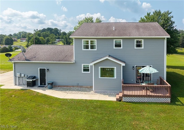 2939 Sandhill Rd, Marietta, OH 45750 - back of property with a deck, a yard, a patio area, and roof with shingles