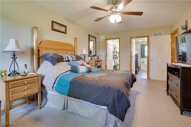 2939 Sandhill Rd, Marietta, OH 45750 - bedroom with light carpet, a ceiling fan, ensuite bath, and a walk in closet