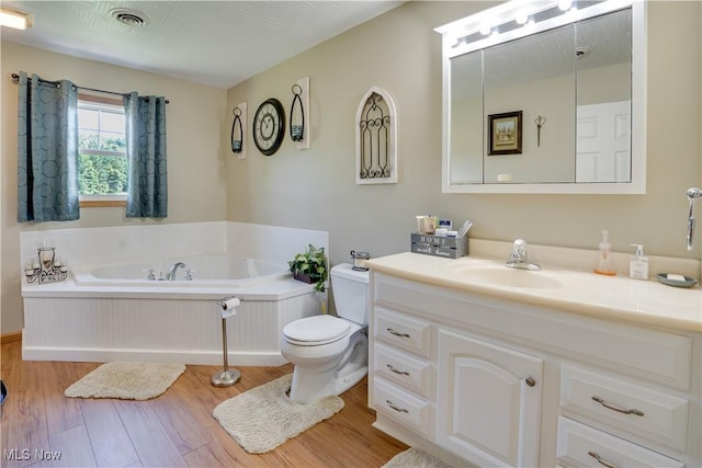 2939 Sandhill Rd, Marietta, OH 45750 - bathroom with wood finished floors, a bath, and vanity