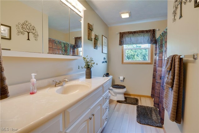 2939 Sandhill Rd, Marietta, OH 45750 - full bath with vanity, wood finished floors, and curtained shower