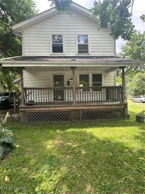 1012 Chandler Ave, Akron, OH 44314 - rear view of property featuring a porch and a yard
