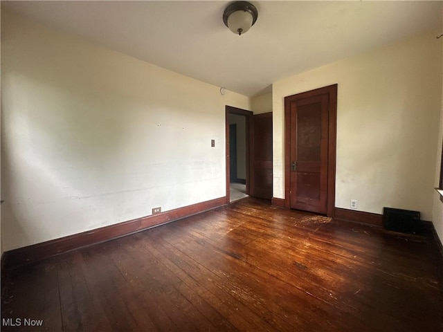 1012 Chandler Ave, Akron, OH 44314 - spare room with wood-type flooring and baseboards