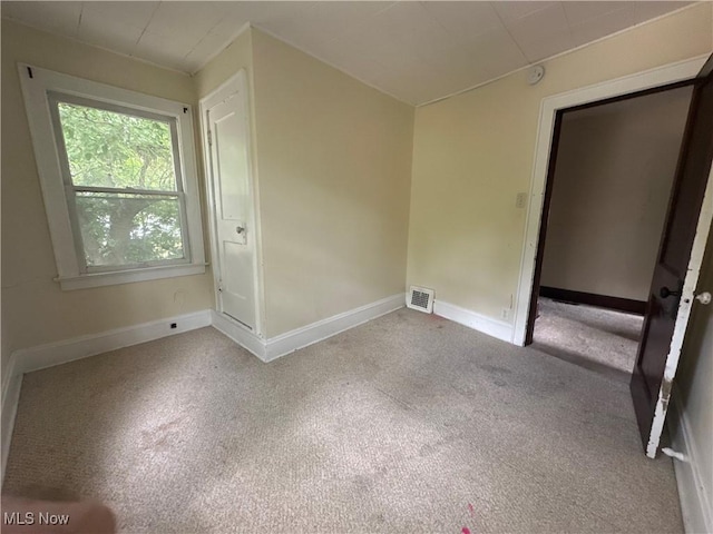 1012 Chandler Ave, Akron, OH 44314 - spare room featuring carpet and baseboards