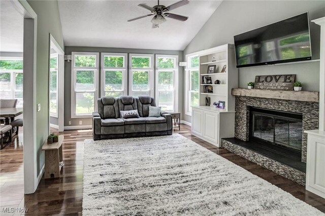 18367 Cranberry Ridge Ln, Chagrin Falls, OH 44023 - living area featuring ceiling fan, dark wood-style floors, a glass covered fireplace, and high vaulted ceiling