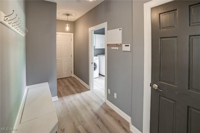 18367 Cranberry Ridge Ln, Chagrin Falls, OH 44023 - hallway with separate washer and dryer and light wood-style floors